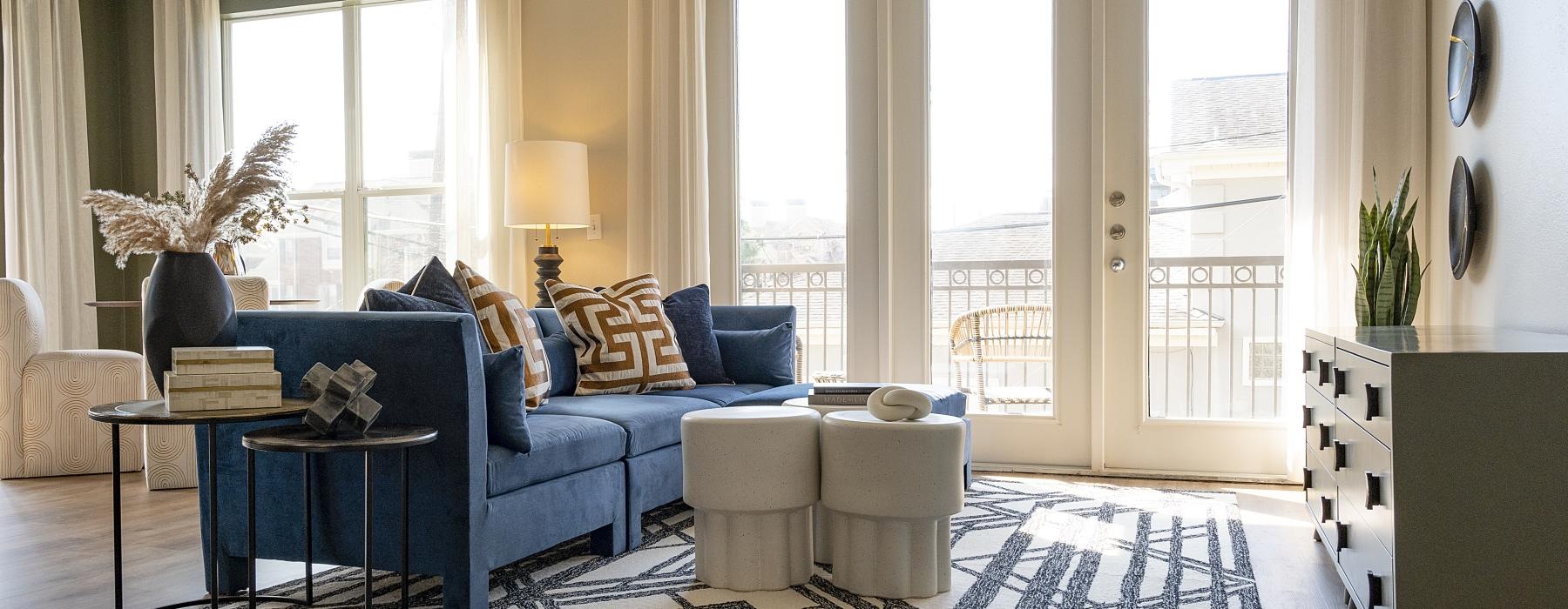 a living room with a blue couch