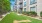 a building with a lawn and a fire hydrant