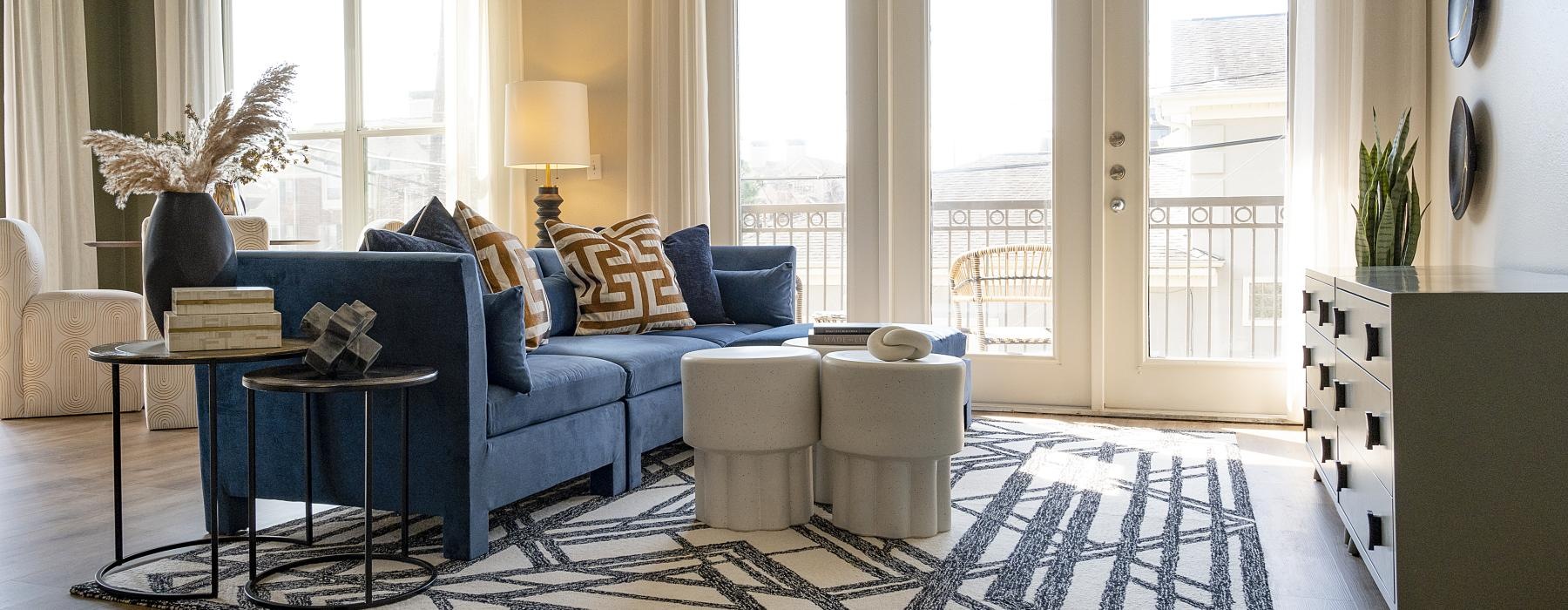 a living room with a blue couch