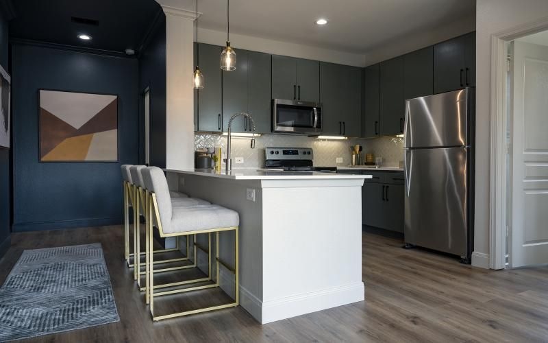 a kitchen with a chair and a table